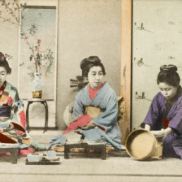three-geisha-girls-eating-a-meal-the-firl-on-the-right-is-serving-rice